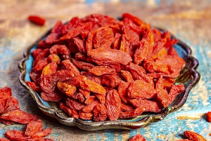 Healthy superfood, red dried goji chinese wolfberry berries, used in many snack foods and supplements, granola bars, yogurt, tea blends, fruit juice as whole berries or ground seeds, seed oil.